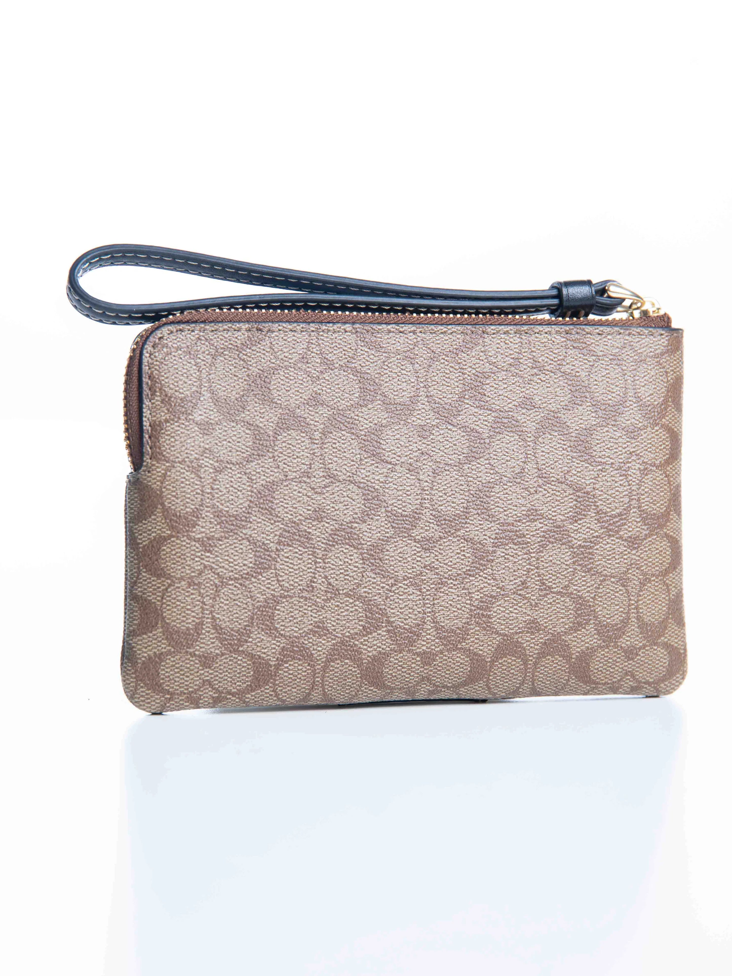 Coach Corner Zip Wristlet In Signature Canvas